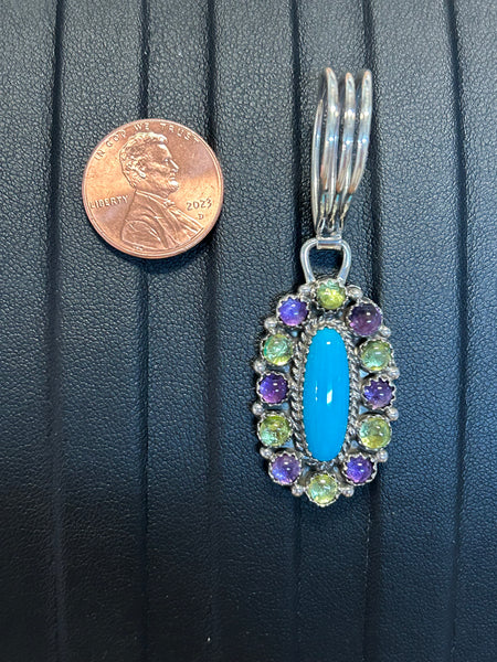 Navajo handcrafted sterling silver pendant with genuine turquoise, Peridot, and Amethyst.  LZ282