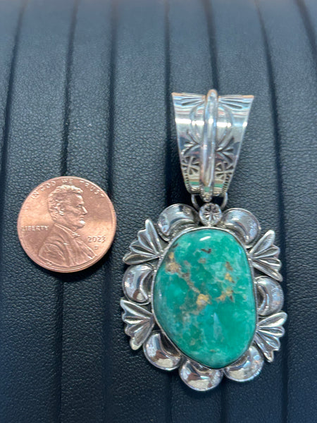 Navajo handcrafted sterling silver pendant with genuine Turquoise.  LZ284