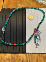 Navajo handcrafted sterling silver necklace with reversible Kokopelli pendant.  LZ294