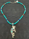 Navajo handcrafted sterling silver necklace with reversible Kokopelli pendant.  LZ294