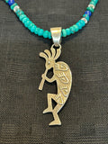 Navajo handcrafted sterling silver necklace with reversible Kokopelli pendant.  LZ294