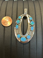 Navajo handcrafted sterling silver pendant with Lab Opal.  LZ295