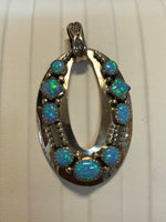 Navajo handcrafted sterling silver pendant with Lab Opal.  LZ295