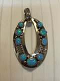 Navajo handcrafted sterling silver pendant with Lab Opal.  LZ295