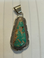 Navajo handcrafted sterling silver pendant with genuine turquoise. LZ301