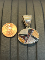 Navajo handcrafted sterling silver pendant with genuine stone inlay.  LZ304
