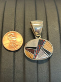 Navajo handcrafted sterling silver pendant with genuine stone inlay.  LZ304