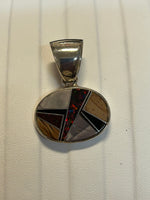 Navajo handcrafted sterling silver pendant with genuine stone inlay.  LZ304