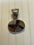 Navajo handcrafted sterling silver pendant with genuine stone inlay.  LZ304