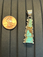 Navajo handcrafted sterling silver pendant with genuine turquoise inlay.  LZ305