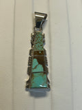 Navajo handcrafted sterling silver pendant with genuine turquoise inlay.  LZ305