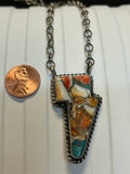 Navajo handcrafted sterling silver necklace with Turquoise and Spiney Oyster composite.