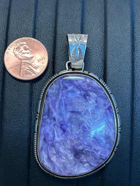 Navajo handcrafted sterling silver pendant with genuine Charoite stone.  LZ314