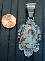 Navajo handcrafted sterling silver pendant by Mary Ann Spencer, genuine turquoise stone.  LZ316
