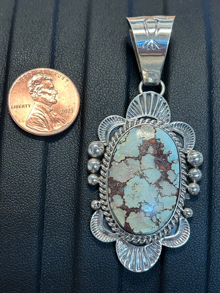 Navajo handcrafted sterling silver pendant by Mary Ann Spencer, genuine turquoise stone.  LZ316