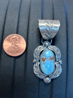 Navajo handcrafted sterling silver pendant by Greg Perry.  Golden Hills Turquoise stones.  LZ318