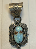 Navajo handcrafted sterling silver pendant by Greg Perry.  Golden Hills Turquoise stones.  LZ318