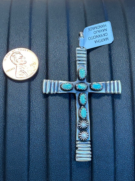 Navajo Handcrafted sterling silver with genuine turquoise stones in a cross.  2 sided.  LZ321