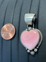 Navajo Handcrafted sterling silver pendant with natural pink Conch shell.  LZ336