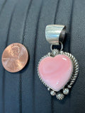 Navajo Handcrafted sterling silver pendant with natural pink Conch shell.  LZ336