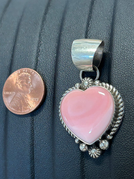 Navajo Handcrafted sterling silver pendant with natural pink Conch shell.  LZ336