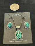 Navajo handcrafted sterling silver necklace and earrings set with genuine turquoise stones.  LZ478