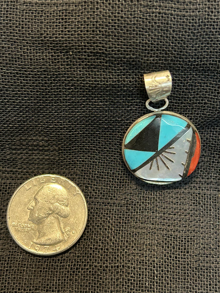 Zuni handcrafted sterling silver pendant with genuine stone inlay.  LZ491
