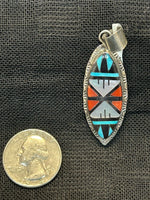 Zuni handcrafted sterling silver pendant with genuine stone inlay.  LZ507