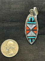 Zuni handcrafted sterling silver pendant with genuine stone inlay.  LZ507