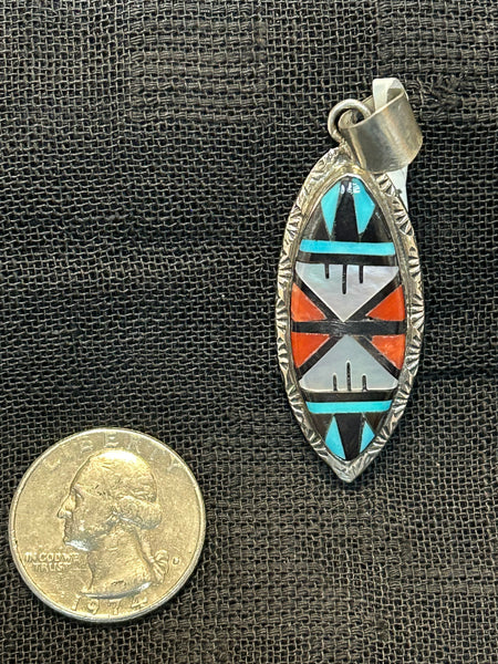 Zuni handcrafted sterling silver pendant with genuine stone inlay.  LZ507
