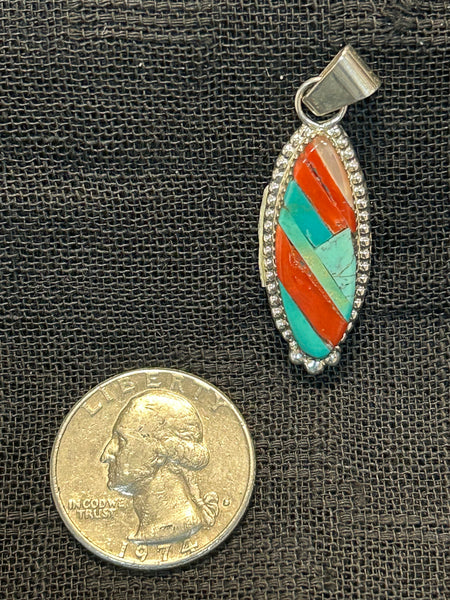 Zuni handcrafted sterling silver pendant with genuine turquoise and coral.  By Wayne Haloo