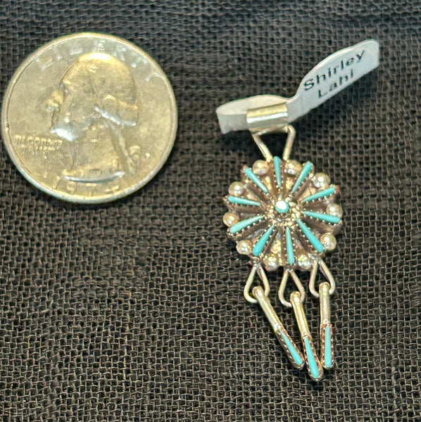 Zuni handcrafted sterling silver pendant with genuine turquoise stones.  By Shirley Lahi.  LZ517