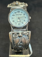 Navajo handcrafted sterling silver watch band with watch.