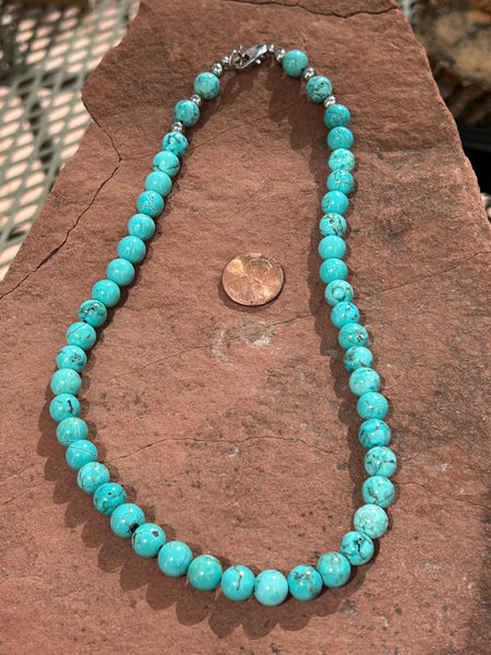 Genuine Turquoise and Howlite  8mm stone bead necklace, 18” long.   SR1089 Hypoallergenic surgical steel clasp.  ST