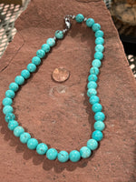 Genuine Turquoise and Howlite 10 mm stone bead 17.5” necklace with hypoallergenic surgical steel clasp.  SR1090