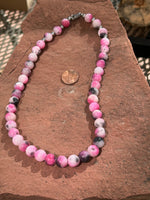 Genuine Persian Jade 10mm stone bead necklace, 19” long.  Hypoallergenic surgical steel clasp and beads.  SR1094