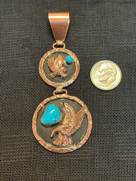 Navajo handcrafted solid copper pendant with genuine turquoise stones.  LZ559