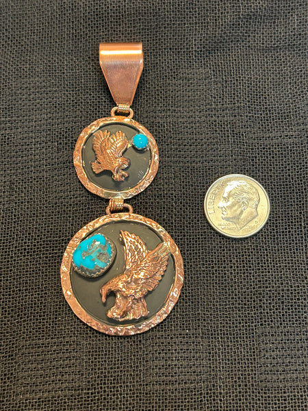 Navajo Handcrafted solid copper with genuine turquoise pendant.  LZ560