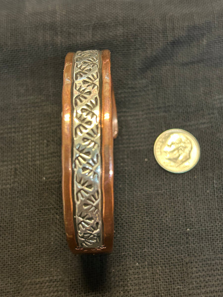 Navajo handcrafted solid copper with sterling silver accents.  LZ587