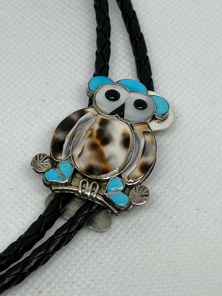 Zuni handcrafted sterling silver with genuine stones and shell bola tie.  LZ717