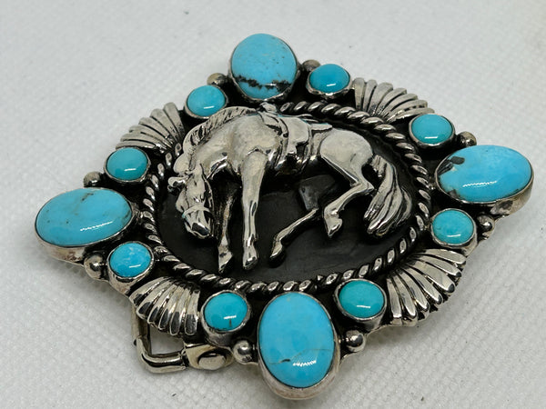 Navajo handcrafted sterling silver with genuine turquoise belt buckle by Emer Thompson.  LZ 681