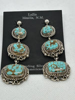 Navajo handcrafted sterling silver earrings with grade AA genuine spiderweb turquoise stones.  LZ635