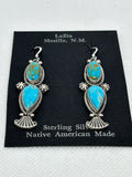 Navajo handcrafted sterling silver earrings with genuine turquoise stones.  LZ397