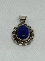 Navajo handcrafted sterling silver pendant with genuine Lapis stone.  LZ340