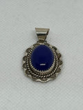 Navajo handcrafted sterling silver pendant with genuine Lapis stone.  LZ340