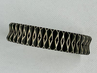 Navajo handcrafted sterling silver bracelet by Leander Tahe. LZ799