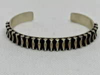 Navajo handcrafted sterling silver bracelet by Leander Tahe.  LZ802