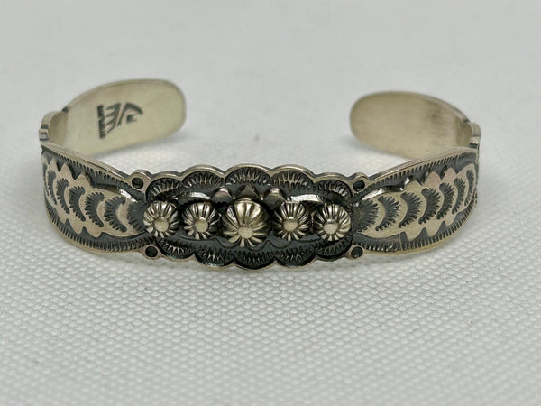 Navajo handcrafted sterling silver bracelet by Bennie Ramon.  LZ804