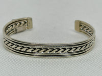 Navajo handcrafted sterling silver bracelet by Elaine Tahe.  LZ805