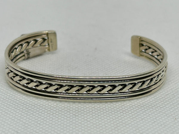 Navajo handcrafted sterling silver bracelet by Elaine Tahe.  LZ805